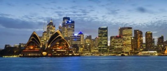 Opera house and buildings lit up at dusk Sydney Opera House Sydney Harbor Sydney New South Wales Australia Canvas Art - Panoramic Images (30 x 13)