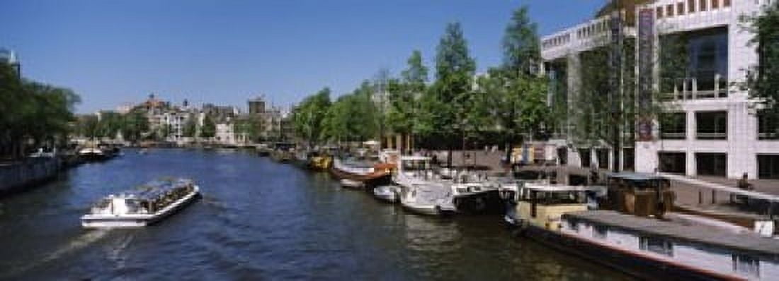 Opera house at the waterfront Amstel River Stopera Amsterdam Netherlands Canvas Art - Panoramic Images (18 x 7)