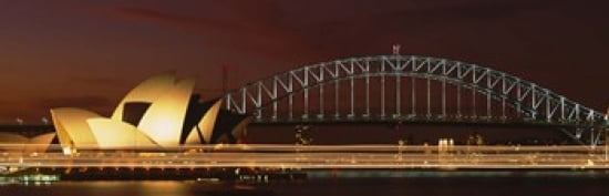 Opera house lit up at night with light streaks Sydney Harbor Bridge Sydney Opera House Sydney New South Wales Australia Canvas Art - Panoramic Images (36 x 12)
