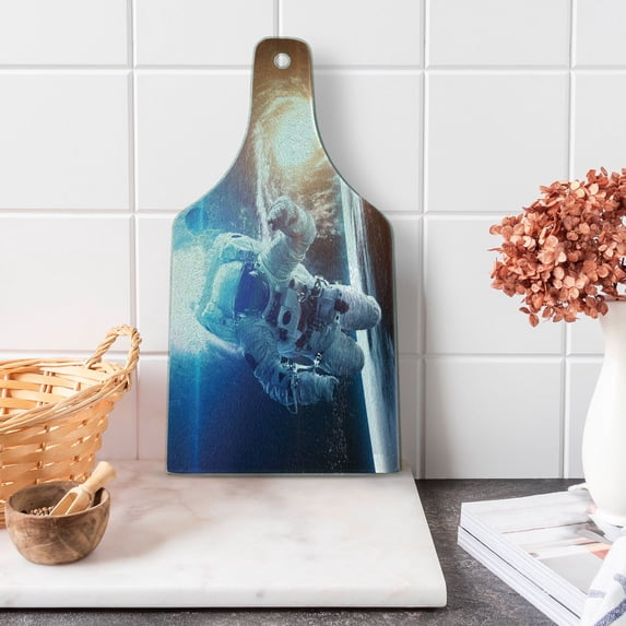 Outer Space Cutting Board, Spaceman in the Galaxy in Front of Nebula Gas Cloud Interstellar Art Print, Tempered Glass Cutting and Serving Board, Wine Bottle Shape, Blue Yellow, by Ambesonne