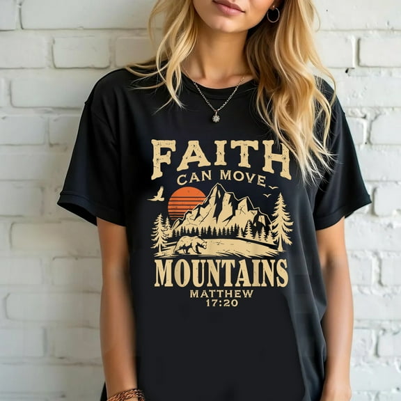 Outstanding Religious T-Shirt with the phrase "Faith Can Move Mountains" along with a landscape design of mountains at sunset/sunrise and the Bible verse Matthew 17:20.