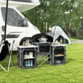 thumbnail image 1 of Outsunny Camping Kitchen Table, Portable Folding Camp Kitchen, Aluminum Cook Station with 3 Fabric Cupboards, Windshield, Carrying Bag, Black, 1 of 9