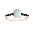 thumbnail image 1 of Oval Cut Lab Created Opal And 0.18 Cttw Enhanced Black Natural Diamond Solitaire Engagement Ring In 14k Rose Gold Over Sterling Silver Ring Size-4, 1 of 1
