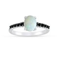 thumbnail image 1 of Oval Cut Lab Created Opal And 0.18 Cttw Enhanced Black Natural Diamond Solitaire Engagement Ring In 14k White Gold Over Sterling Silver Ring Size-5, 1 of 1