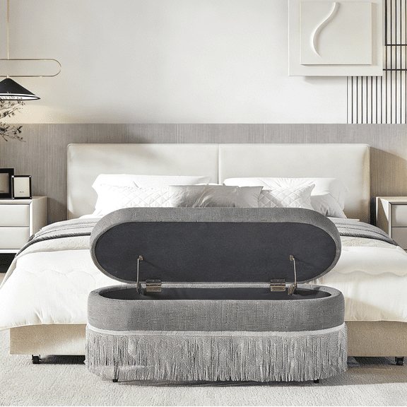 Oval Upholstered Storage Ottoman with Fringe Trim & Lift-Top Lid - 39"L x 16"W x 17"H, Multi-Functional Footrest with Hidden Storage for Living Room or Bedroom, Grey Fabric with Metal Frame