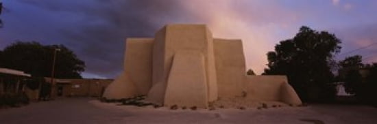 Overcast clouds sky over a church San Francisco de Asis Church Ranchos De Taos New Mexico USA Canvas Art - Panoramic Images (36 x 12)