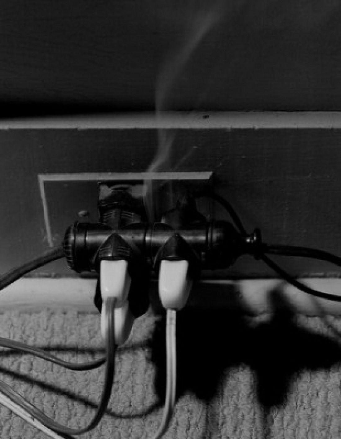 Overloaded electric outlet burning Canvas Art -  (18 x 24)