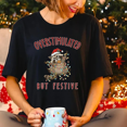 thumbnail image 1 of Overstimulated But Festive Christmas T-Shirt, Funny Holiday Raccoon Graphic Tee — Great for Christmas Gifting, 1 of 2
