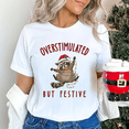 thumbnail image 1 of Overstimulated But Festive Christmas T-Shirt, Funny Holiday Raccoon Graphic Tee — Great for Christmas Gifting, 1 of 2