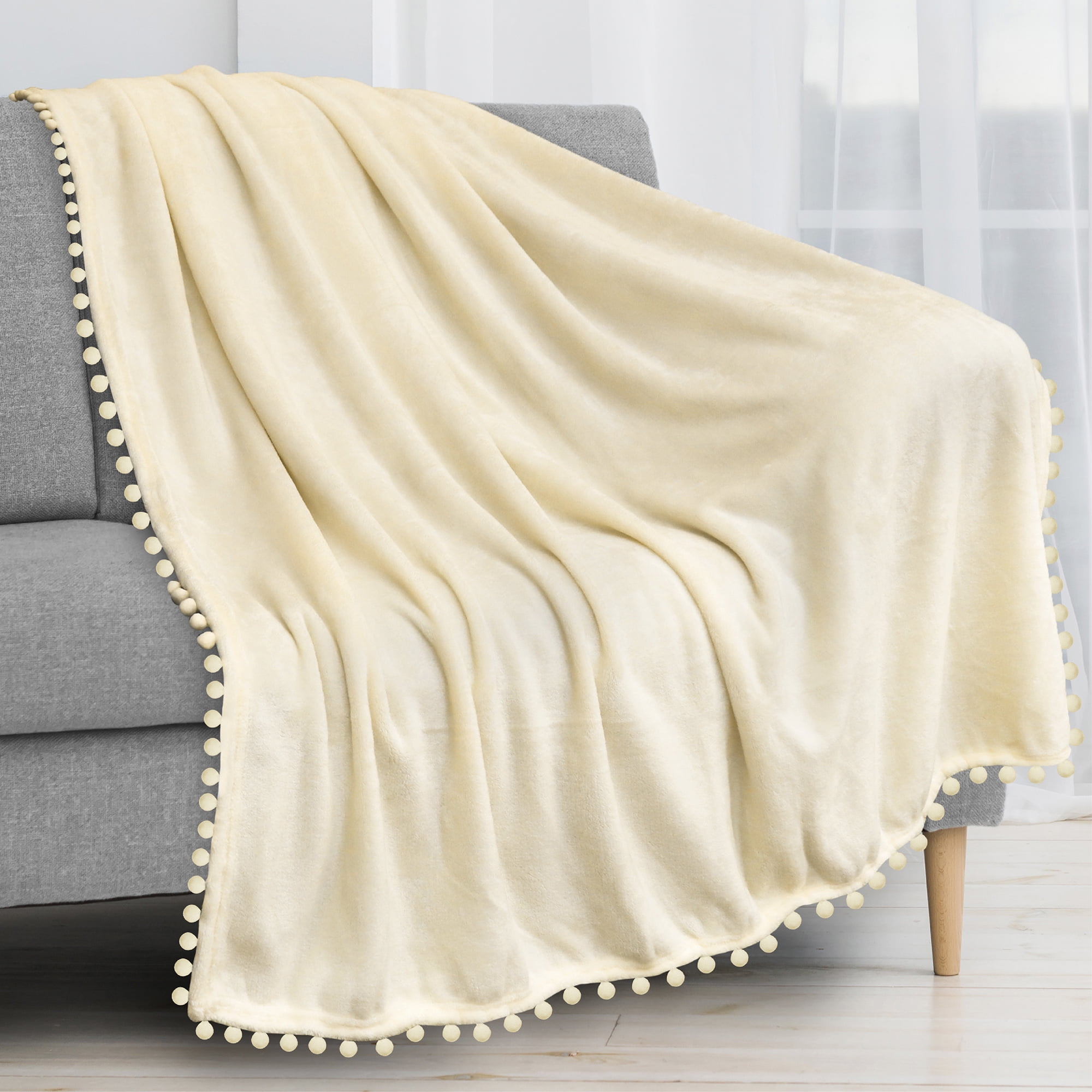 PAVILIA Fleece Throw Blanket for Couch with Pom Pom Fringe, Cream Beige, Soft Cozy Fuzzy Flannel Blanket for Sofa Bed, Lightweight Plush All Season Throw, 50x60 Inches