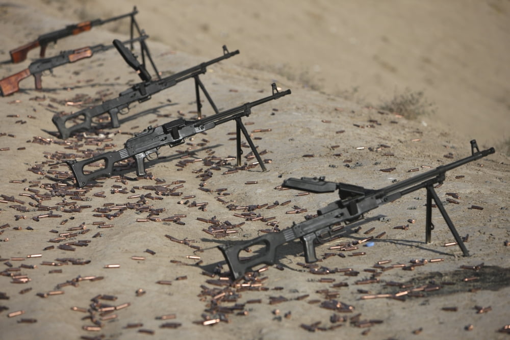 PK machine guns and spent cartridges at the firing range Canvas Art - Terry MooreStocktrek Images (35 x 24)