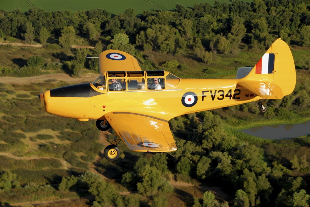PT-26 flying over Sacramento Valley California Canvas Art - Phil WallickStocktrek Images (34 x 23)