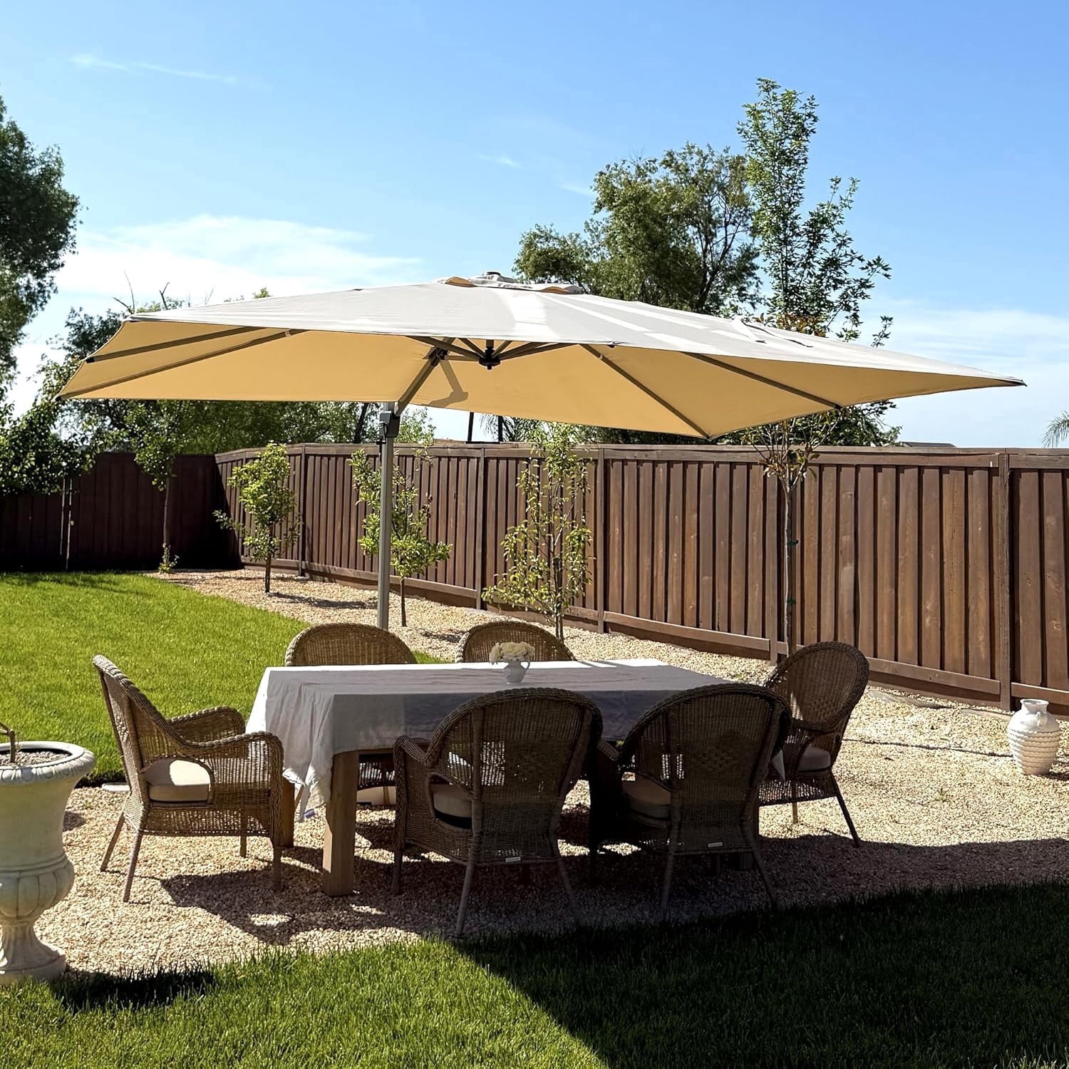 11ft rectangular patio umbrella Outdoor Aluminum Black x 8ft with Cran lounging at the beach California Umbrella Tahoe Series 11