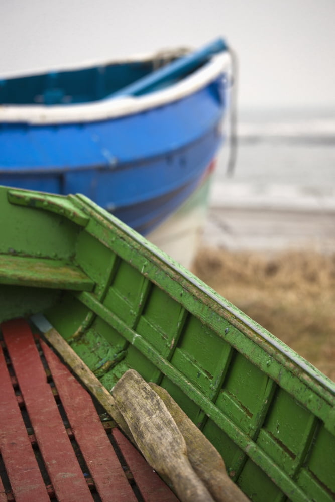 Paddles in a colourful wooden rowboat on the shoreBoulmer northumberland england Canvas Art - John Short Design Pics (12 x 19)