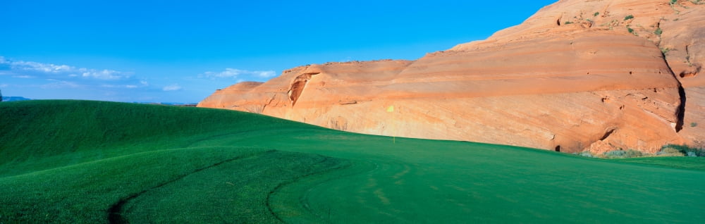 This is the Page Municipal Golf Course with a background hill made of sandstone rock It shows a green golf course in the middle of a desert environment Canvas Art - Panoramic Images (36 x 12)