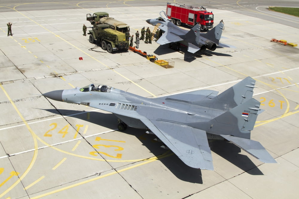 Pair of Serbian Air Force MiG-29 aircraft at Graf Ignatievo Air Base Canvas Art - Anton BalakchievStocktrek Images (35 x 23)