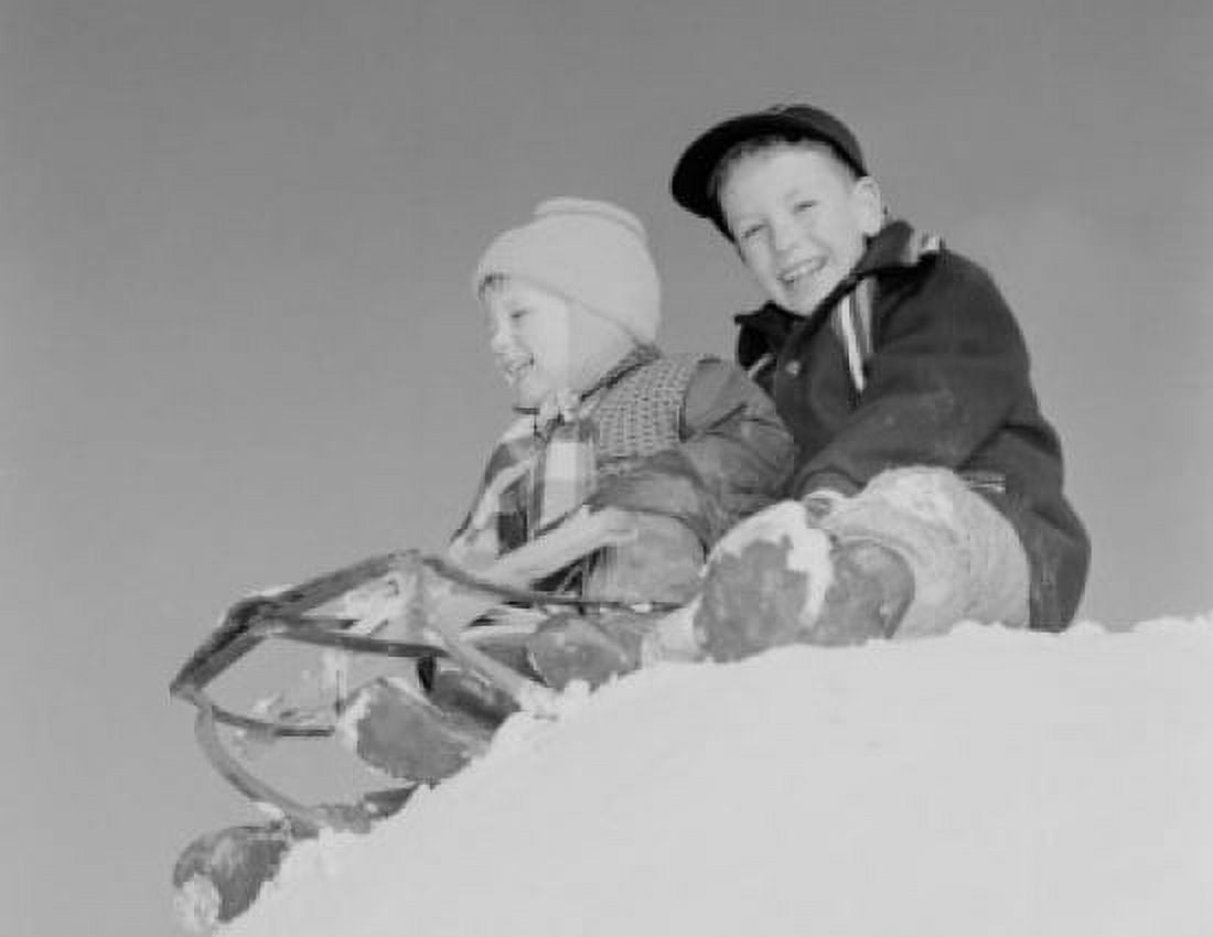 Pair of children sledging in winter scenery Canvas Art - (18 x 24)