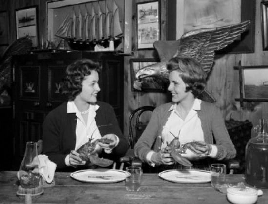 Pair of young women preparing to eat lobsters in restaurant Canvas Art - (18 x 24)