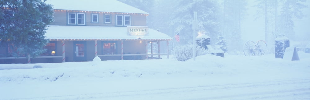 Pale hotel in winter snowstorm Lake Tahoe area California Canvas Art - Panoramic Images (27 x 9)