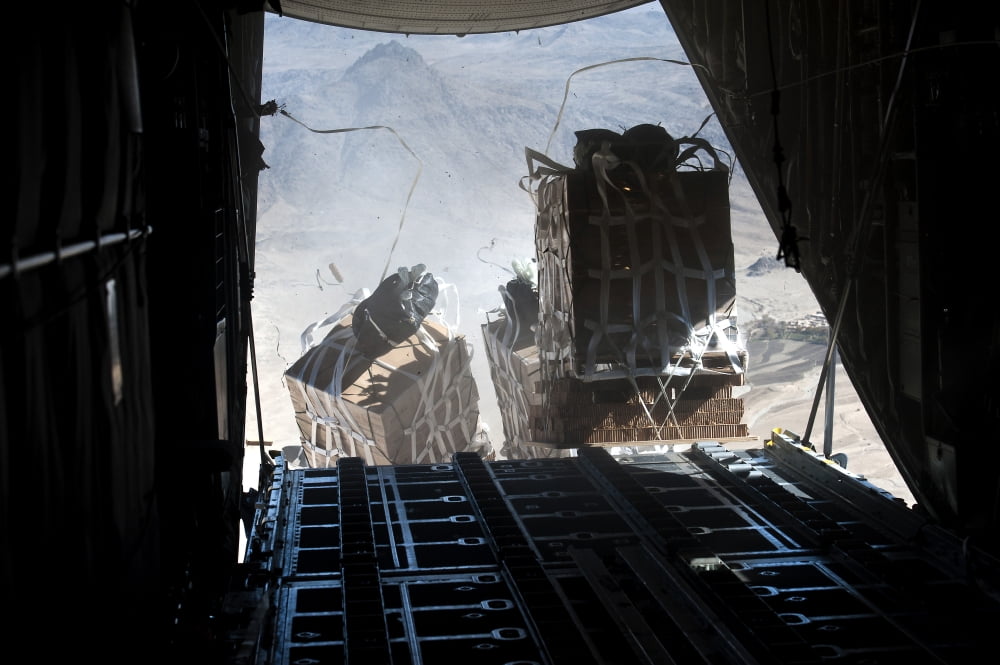 Pallets are released from a C-130 Hercules over Afghanistan Canvas Art - Stocktrek Images (34 x 23)