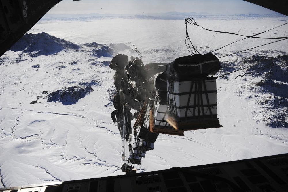 Pallets are released from a C-130 Hercules over Afghanistan Canvas Art - Stocktrek Images (35 x 23)