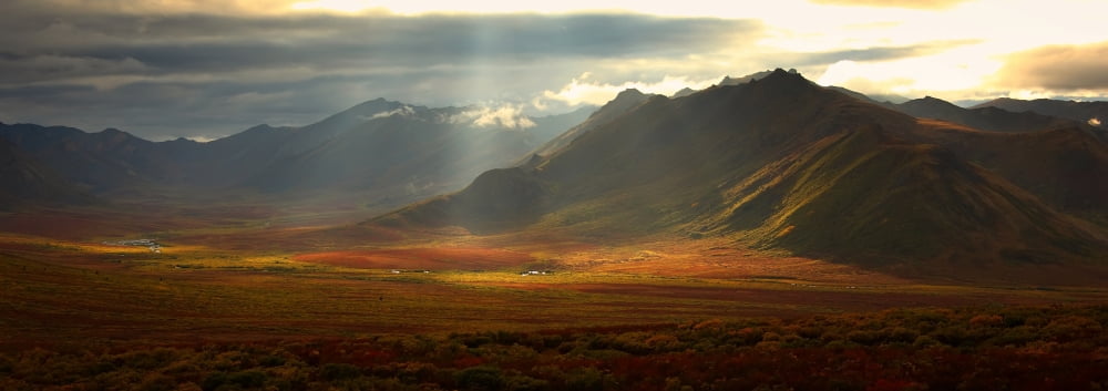 Panoramic Image Of The Cloudy Range With Shafts Of Sunlight Hitting The Fall Colours Of The Dempster Highway Yukon Canvas Art - Robert Postma Design Pics (44 x 15)