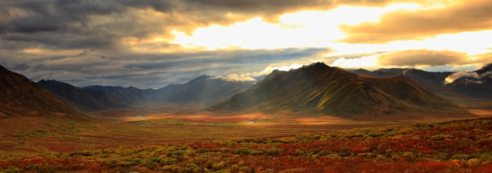 Panoramic Image Of Late Afternoon Sunlight Shining Between Storm Clouds On The Fall Colours Along The Dempster Highway Yukon Canvas Art - Robert Postma Design Pics (23 x 8)