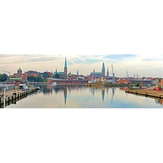 Panoramic Images PPI144746L Buildings at the waterfront with church towers in distance Trave River Lubeck Schleswig-Holstein Germany Poster Print by Panoramic Images - 36 x 12