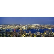 Panoramic Images PPI78740L Aerial View Of Buildings Lit Up At Dusk  Manhattan  NYC  New York City  New York State  USA Poster Print by Panoramic Images - 36 x 12