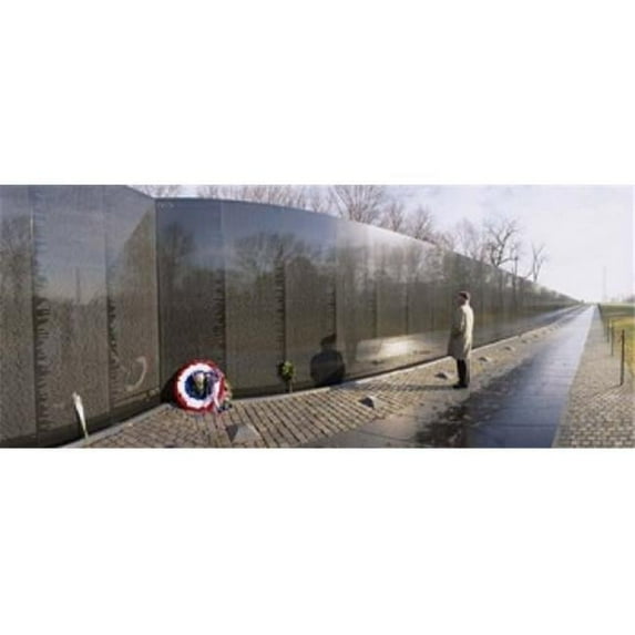 Panoramic Images Side profile of a person standing in front of a war memorial Vietnam Veterans Memorial Washington DC USA Poster Print by Panoramic Images - 36 x 12