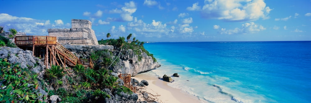 A Panoramic of Mayan ruins of Ruinas de Tulum (Tulum Ruins) and El Castillo at sunset with beach and Caribbean Sea in Quintana Roo Yucatan Peninsula Mexico Canvas Art - Panoramic Images (36 x 12)
