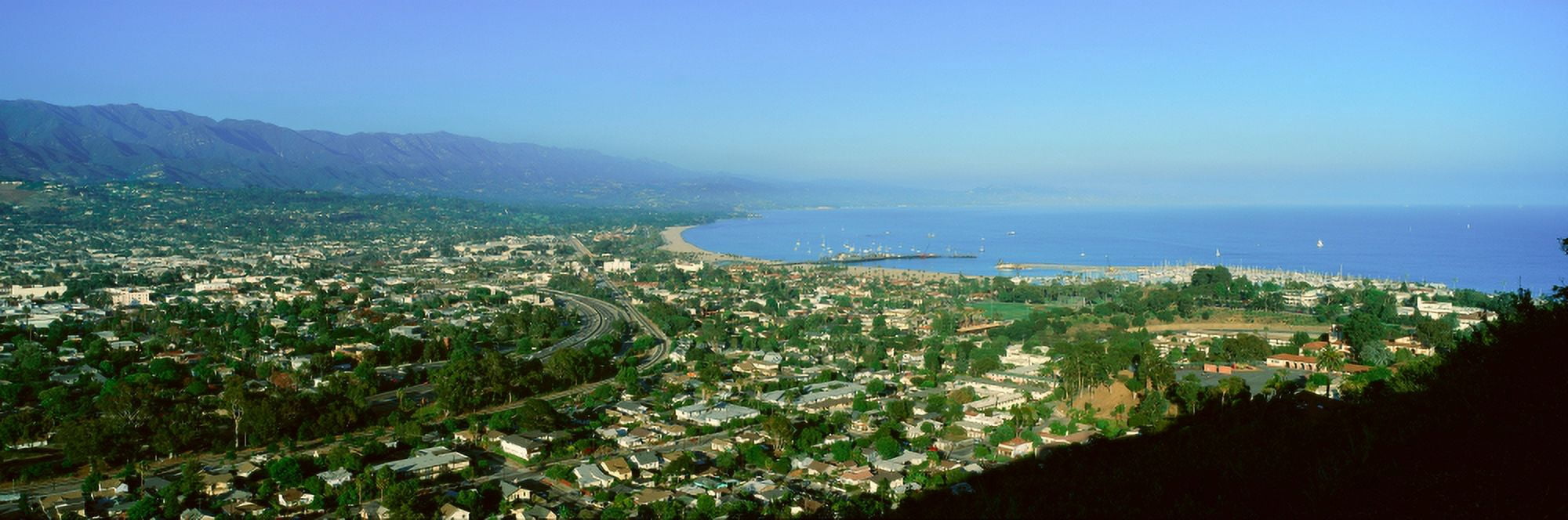 Panoramic aerial view of Santa Barbara California and Pacific Ocean with harbor in view Canvas Art - Panoramic Images (27 x 9)