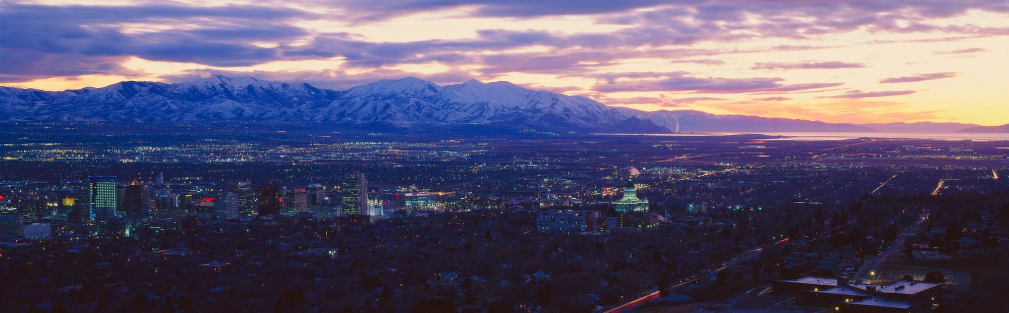 Panoramic sunset of Salt Lake City with snow capped Wasatch Mountains Canvas Art - Panoramic Images (9 x 30)