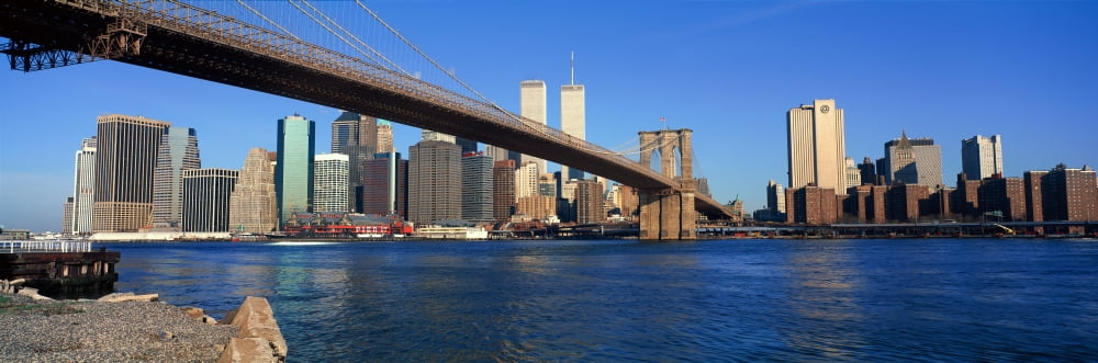 Panoramic view of East River and Brooklyn Bridge going to lower Manhattan New York City New York with World Trade Center Canvas Art - Panoramic Images (27 x 9)