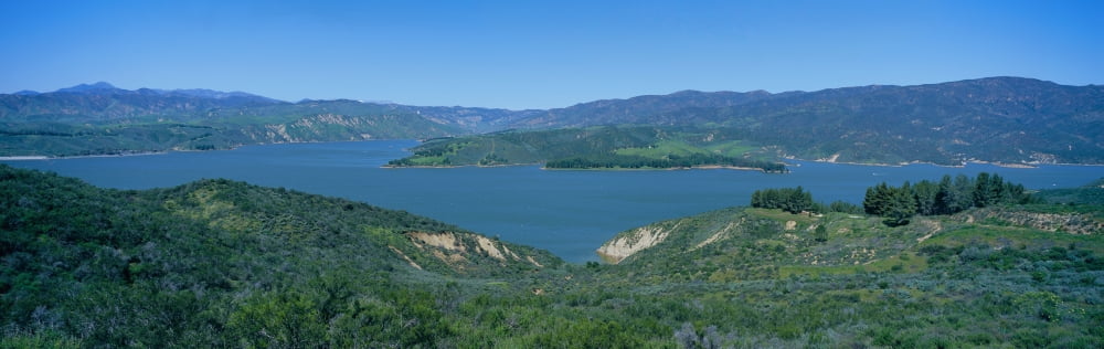Panoramic view of Lake Castaic with green rolling hills and mountains near Interstate 5 north of Los Angeles in springtime California Canvas Art - Panoramic Images (36 x 12)