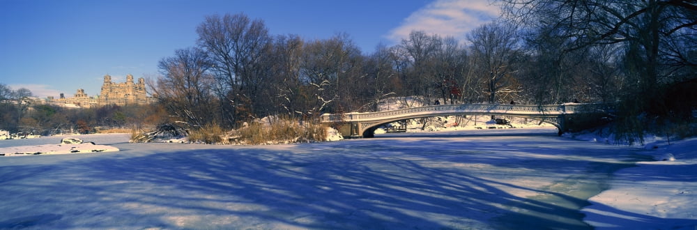 Panoramic view of bridge over frozen pond in Central Park Manhattan NY on upper west side near Central Park West Canvas Art - Panoramic Images (27 x 9)