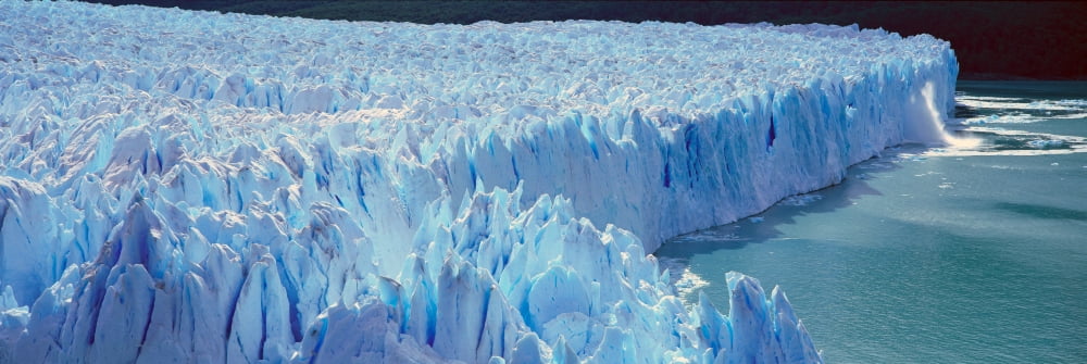Panoramic view of icy formations of Perito Moreno Glacier at Canal de Tempanos in Parque Nacional Las Glaciares near El Calafate Patagonia Argentina Canvas Art - Panoramic Images (36 x 12)