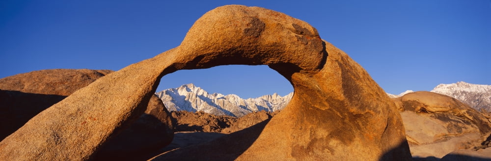 Panoramic view of Mount Whitney framed through Alabama Hills Arch in Alabama Hills near Lone Pine California Canvas Art - Panoramic Images (36 x 12)