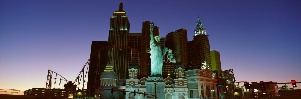 Panoramic view of New York New York Hotel with Statue of Liberty at sunrise Las Vegas NV Canvas Art - Panoramic Images (27 x 9)