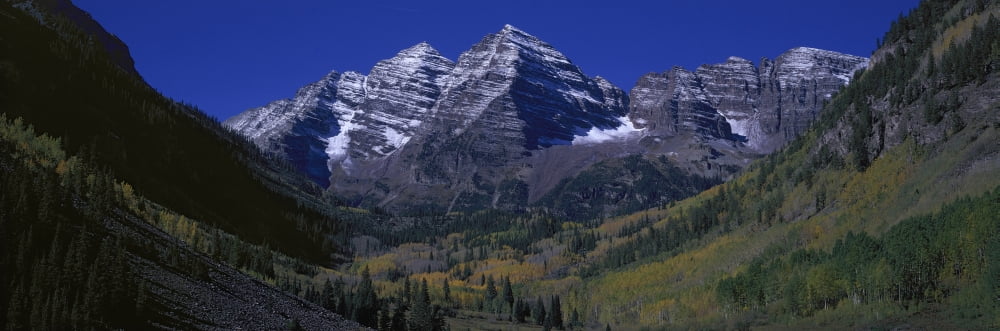Panoramic view of autumn colors of Aspens reflecting in lake under Maroon Bells Colorado near Aspen Canvas Art - Panoramic Images (36 x 12)