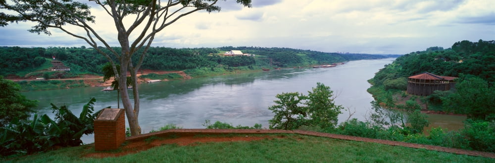 Panoramic view of confluence of Iguazu and Parava Rivers at borders of Chile Brazil and Argentina Canvas Art - Panoramic Images (27 x 9)