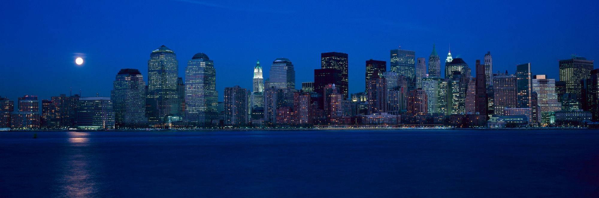 Panoramic view of full moon rising over lower Manhattan skyline NY where World Trade Towers were located Canvas Art - Panoramic Images (27 x 9)