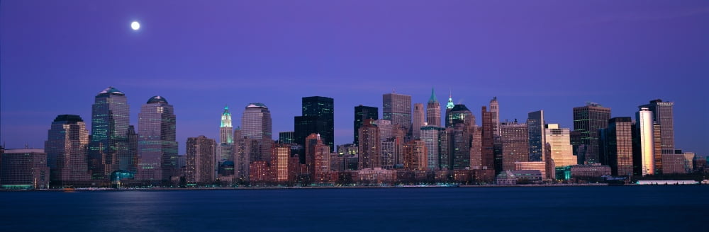 Panoramic view of full moon rising over lower Manhattan skyline NY where World Trade Towers were located Canvas Art - Panoramic Images (36 x 12)