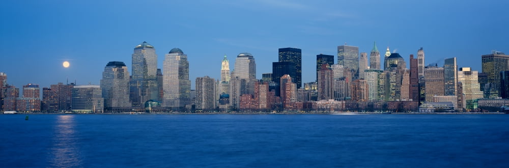 Panoramic view of full moon rising over lower Manhattan skyline NY where World Trade Towers were located Canvas Art - Panoramic Images (36 x 12)