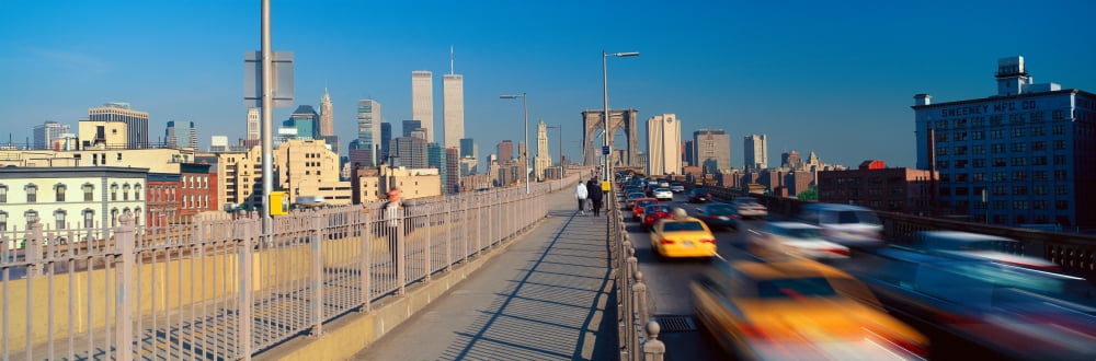 Panoramic view of speeding taxis driving over Brooklyn Bridge to Manhattan New York City NY Canvas Art - Panoramic Images (27 x 9)