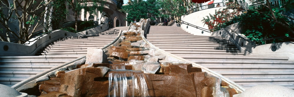 Panoramic view of stairs and waterfall in downtown Los Angeles California lead into a shopping area Canvas Art - Panoramic Images (36 x 12)