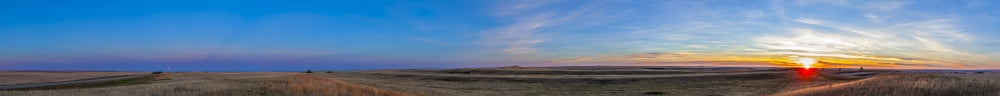 Panoramic view of the rising harvest moon and setting Sun Alberta Canada Canvas Art - Alan DyerStocktrek Images (46 x 5)