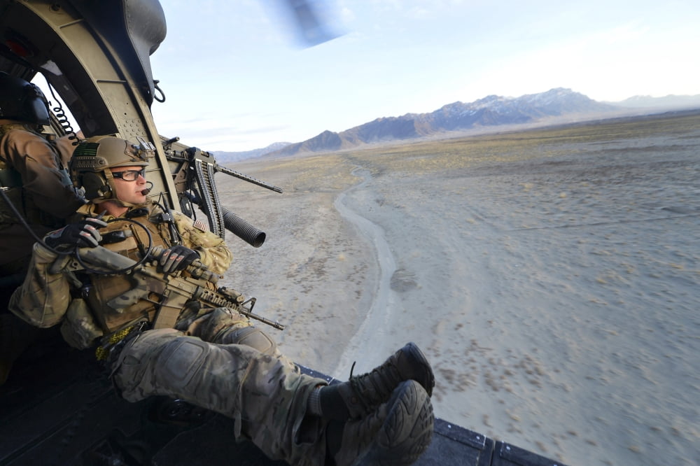 Pararescueman watches the terrain during a training mission in Afghanistan Canvas Art - Stocktrek Images (35 x 23)