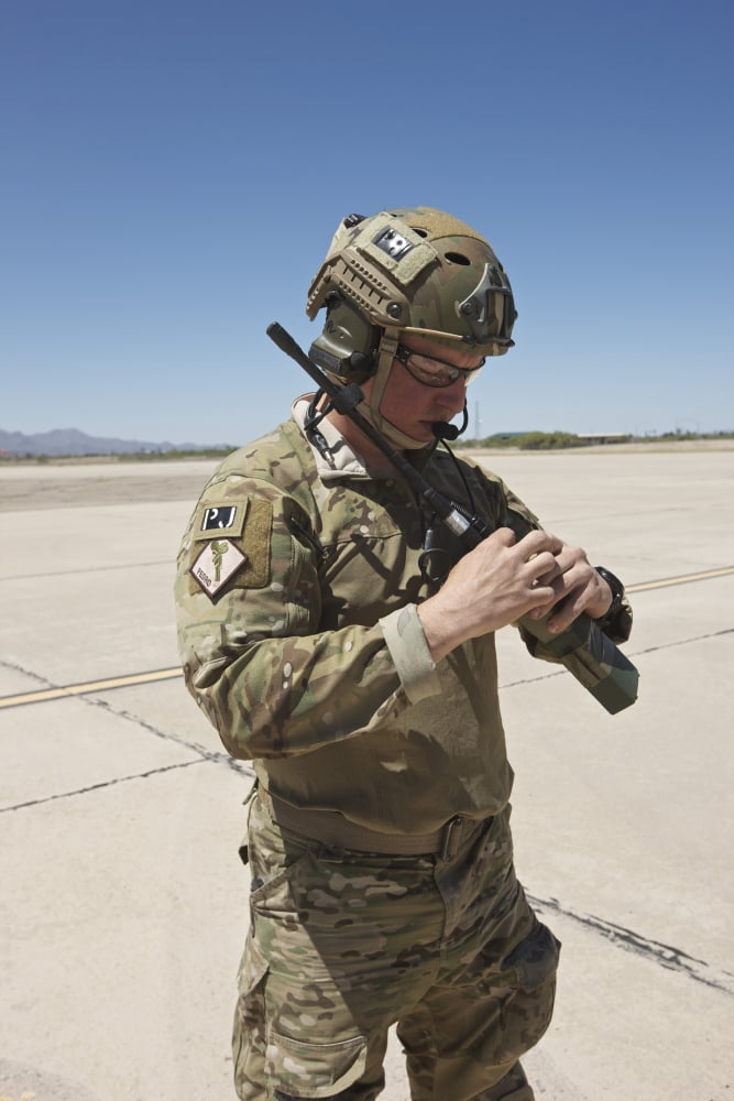 Pararescuemen conducts a communications check with his Sat radio Canvas Art - Terry MooreStocktrek Images (12 x 18)