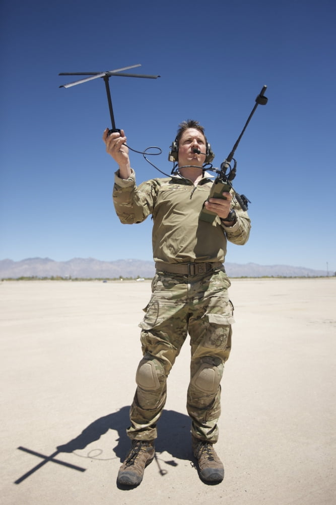 Pararescuemen conducts a communications check with his Sat radio Canvas Art - Terry MooreStocktrek Images (12 x 18)